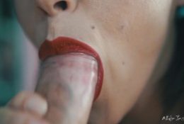 Girl with red lipstick pumps cock in her mouth